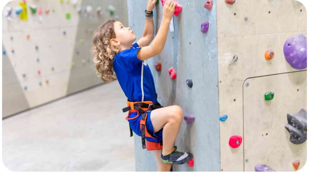 a person is climbing on a climbing wall